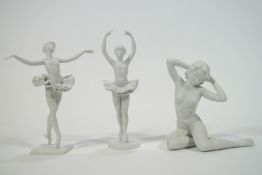 Two Kaiser porcelain bisque figures of ballerinas, boxed, together with another of a lady,