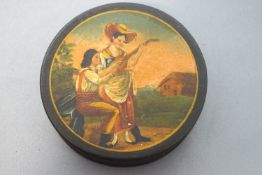 A 19th century papier mache snuff box, the cover painted with a lady and her companion,
