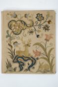 A folio embroidered in 17th century style with wildlife and scrolling branches,