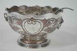A mid 20th century silver plated punch bowl and ladle, of large proportions,