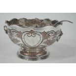 A mid 20th century silver plated punch bowl and ladle, of large proportions,