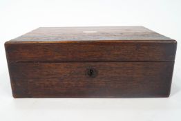 A Victorian rosewood writing slope, the top ivory inset plaque,