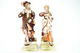 A 19th century matched pair of porcelain figures by Ernest Bohne & Sohne, in medieval dress,
