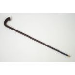 A hardwood walking stick with hardwwod handle,
