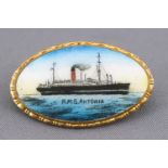 An enamelled metal oval brooch for the RMS Antonia
