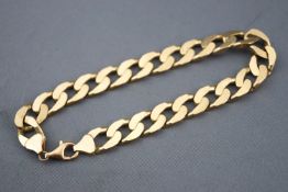 A yellow metal filed curb bracelet, trigger clasp. 230mm. Hallmarked 9ct gold, Birmingham.