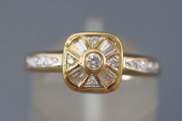 A yellow metal dress ring set with baguette cut and round brilliant cut diamonds.