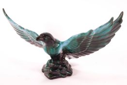 A large streaked Poole Pottery turquoise figure of an eagle taking flight,