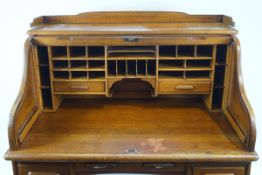 An early 20th century oak roll top Derby desk,