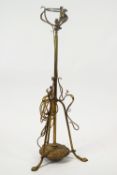 A Victorian brass standard oil lamp, converted to electricity, in Art Nouveau style,