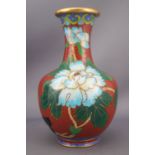 A cloissone vase and cover, decorated in blue enamels with flower heads,