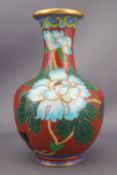 A cloissone vase and cover, decorated in blue enamels with flower heads,