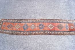 A Middle Eastern long runner of traditional design,