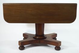 A William IV mahogany Pembroke table on wasted rectangular base and bun feet,