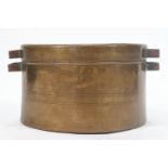 A large copper two handled pan and cover,