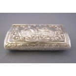 A Continental white metal snuff box of elongated oval section with lift up hinged cover,