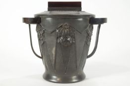 A pewter and rosewood mounted biscuit barrel and cover by R Setollis, Paris, impressed marks,