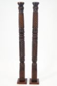 A pair of mahogany carved columns, formerly from a four posted bed,