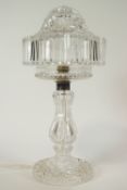 A cut glass table lamp with shade,