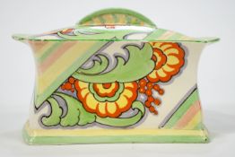An Art Deco pottery biscuit box and cover painted in coloured enamels,