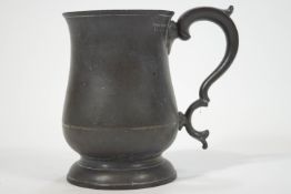 A pewter mug, by James Yates, of traditional baluster form,