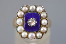 A Georgian yellow metal cluster ring having a blue enamel finish centrally set