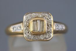 A yellow metal dress ring.