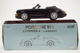 An Anson 1:14 Porsche 911 Carrera 4 cabriolet, boxed, together with four other boxed Porsche cars,