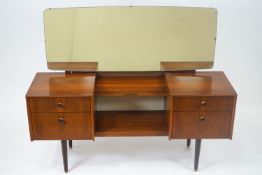 A G-Plan teak dressing table with rectangular landscape mirror cube ends each set two drawers