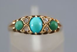 A yellow metal half hoop ring set with three cabochon cut turquoise