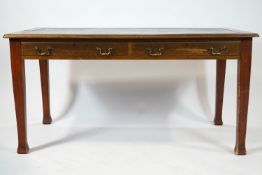 A mahogany library table, the leather inset top frieze drawers on square tapering legs,