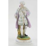 A French bisque figure of a gentleman holding a bird,