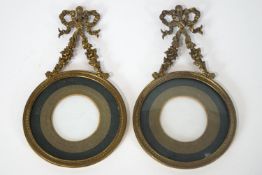 A pair of 19th century French gilt metal miniature frames, 11cm diameter,