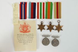 A group of five World War II medals and ribbons