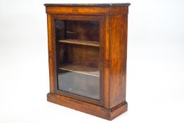 A walnut pier cabinet with sample wood inlaid decoration,