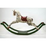 A 19th century carved wood rocking horse, painted as a dapple grey,
