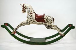 A 19th century carved wood rocking horse, painted as a dapple grey,