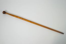 An Irish Blackthorn Shillelagh and an inlaid malacca cane 101cm and 87cm respectively