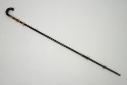 A 19th century parasol stick inset with an agate panel and gilt metal mounts,