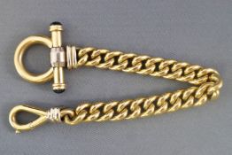 A yellow metal heavy curb link bracelet with feature swivel and toggle clasp