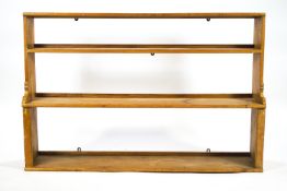 A pine plate rack in waterfall form,