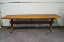 A refectory table and two matching bench seats by Geoffrey Juniper,