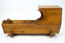 A 19th century style pine cradle,