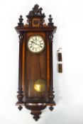 A 19th century mahogany cased Vienna regulator with moulded lion crest,