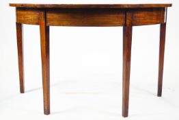 A George III mahogany demi-lune side table on square tapering legs,