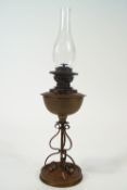 An Arts and Crafts style brass oil lamp,