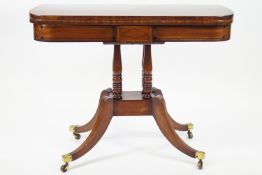 A Regency inlaid mahogany card table with inlaid ebony highlights,