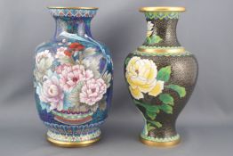 A cloisonne vase, decorated with flower heads on a black ground, 21cm high,