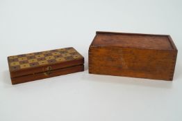 A boxed Staunton style chess set and a mixed wood travelling chess set with bone pieces