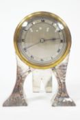 An Arts and Crafts style mantel clock, the French movement in silver plated case, marked WCSld,